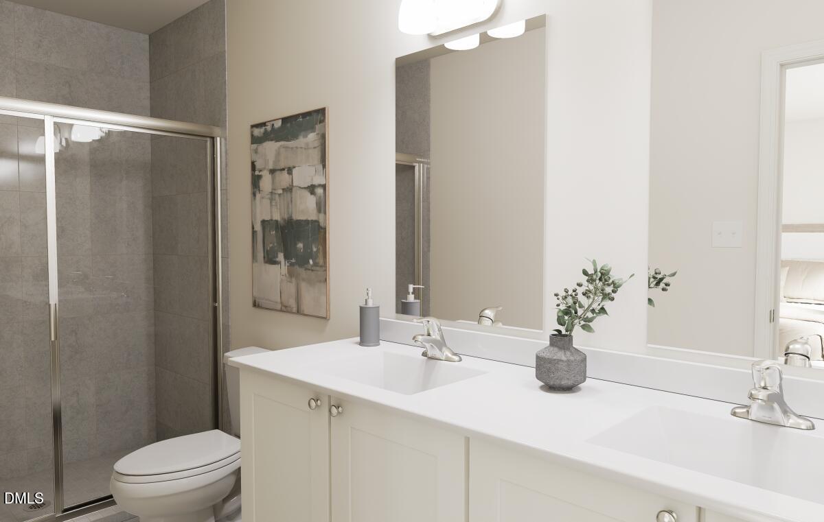 330 Short Ridge Way Rolesville, NC 27571 - Photo 11 of 24 a bathroom with a sink a toilet and shower