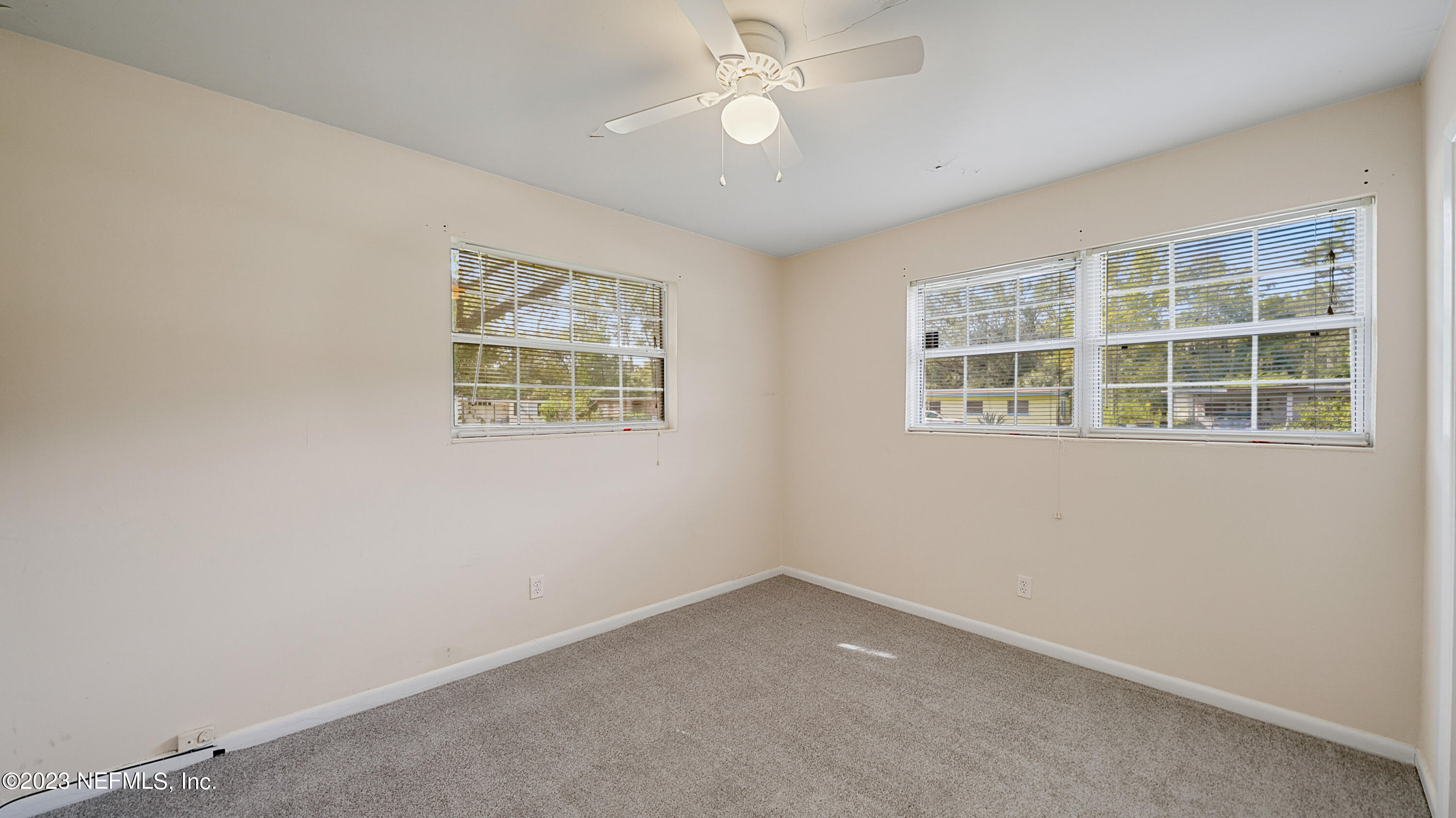 7057 Rollo Road Jacksonville, FL 32205 - Photo 15 of 30 an empty room with a window