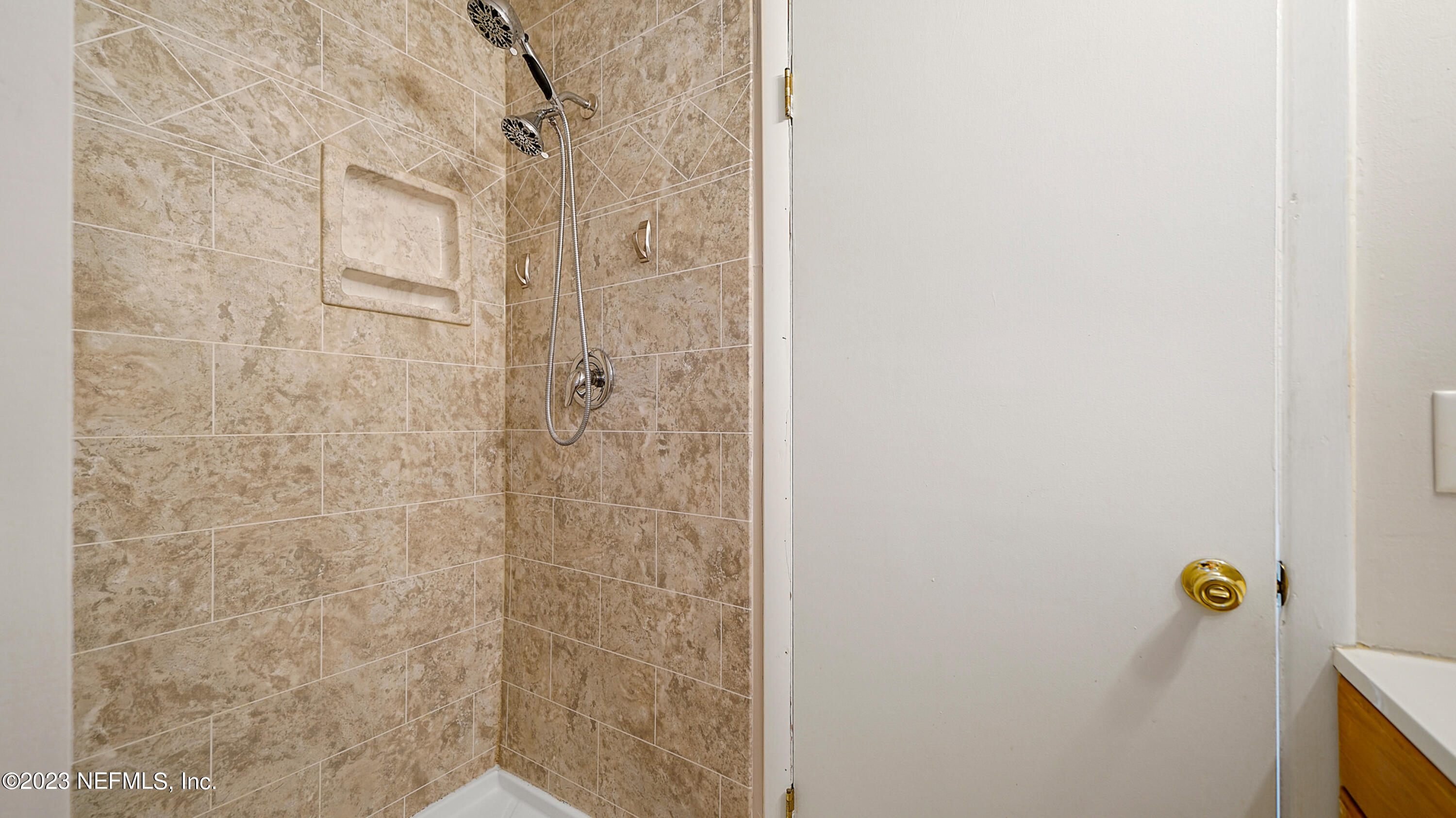 7057 Rollo Road Jacksonville, FL 32205 - Photo 18 of 30 a bathroom with a shower