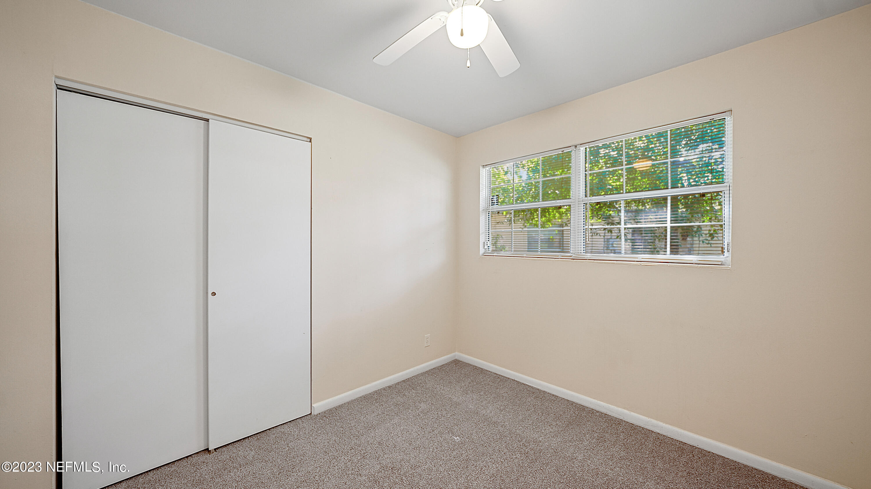7057 Rollo Road Jacksonville, FL 32205 - Photo 20 of 30 an empty room with a window