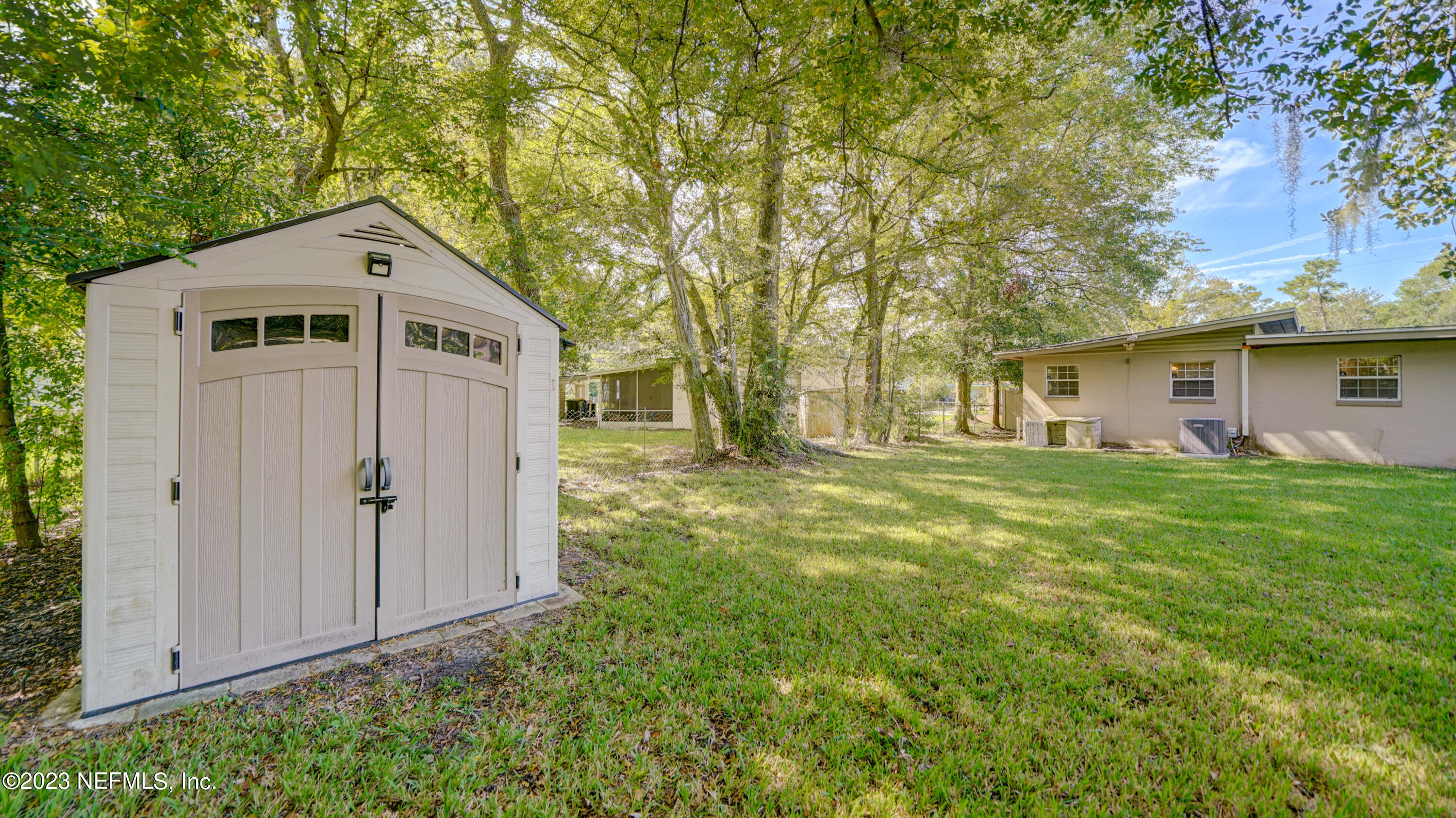 7057 Rollo Road Jacksonville, FL 32205 - Photo 27 of 30 a front view of a house with garden