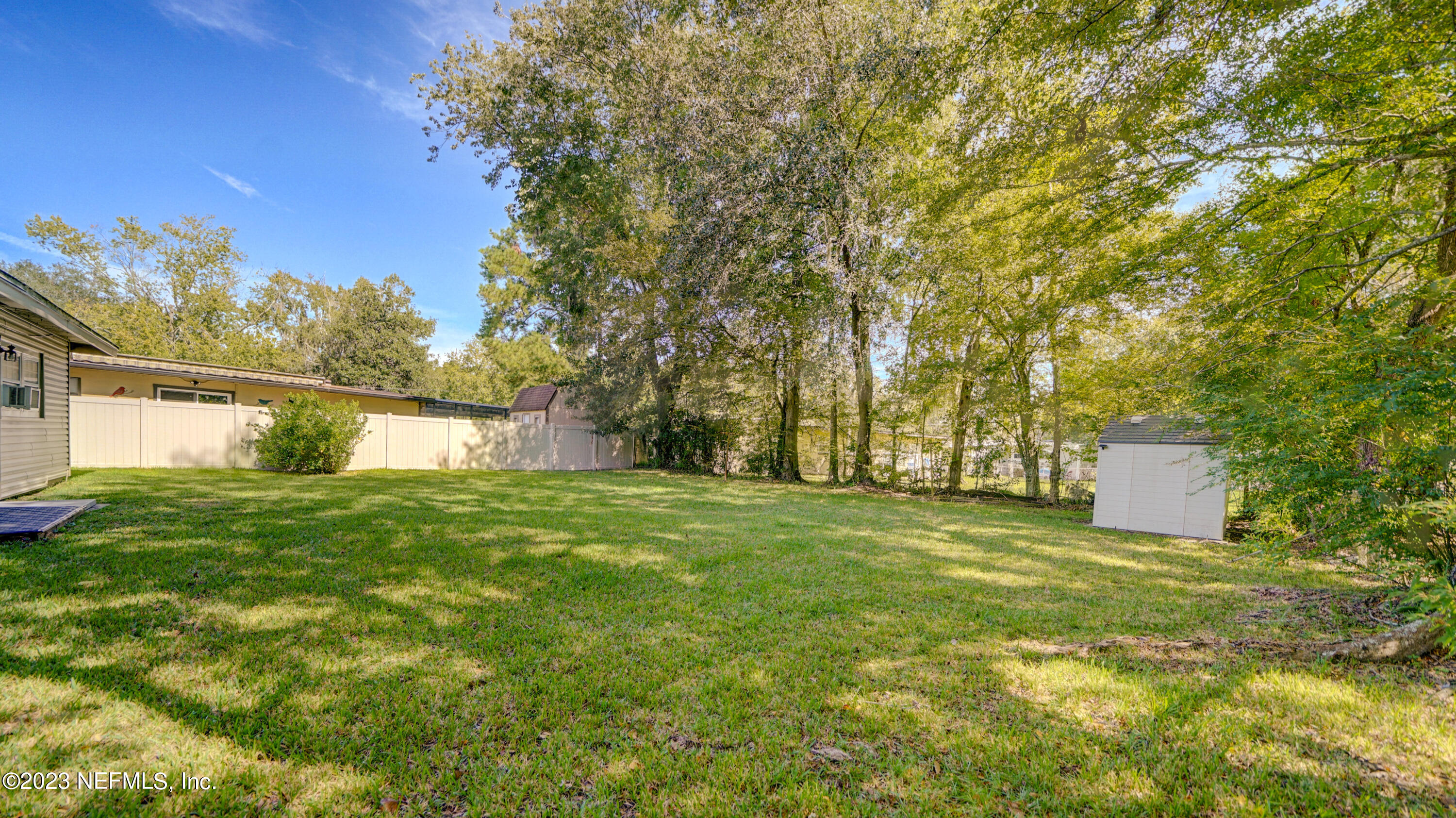 7057 Rollo Road Jacksonville, FL 32205 - Photo 29 of 30 a view of a big yard with large trees