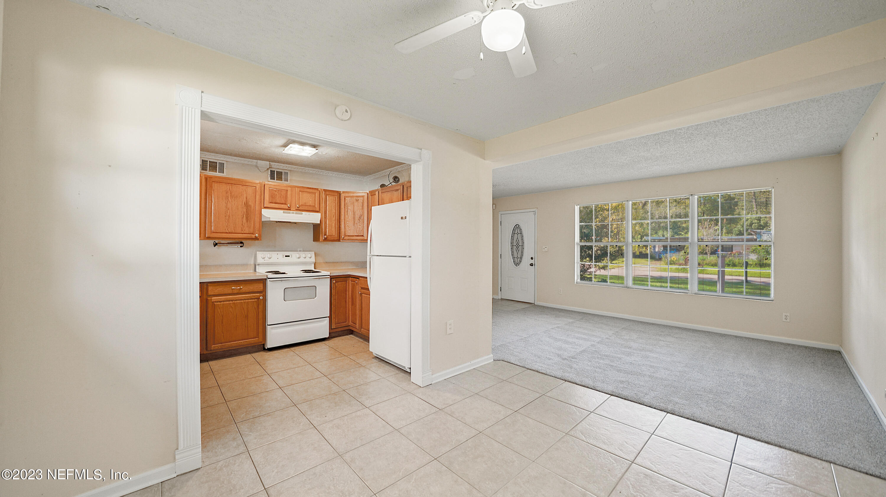 7057 Rollo Road Jacksonville, FL 32205 - Photo 4 of 30 a view of a kitchen with a sink and a window