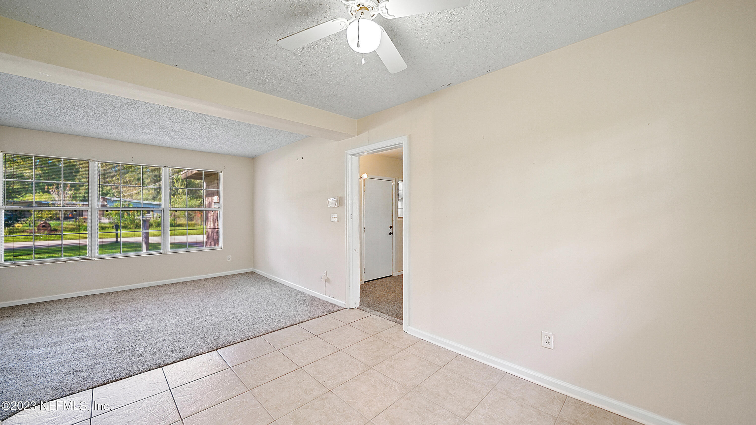 7057 Rollo Road Jacksonville, FL 32205 - Photo 10 of 30 a view of an empty room with a window