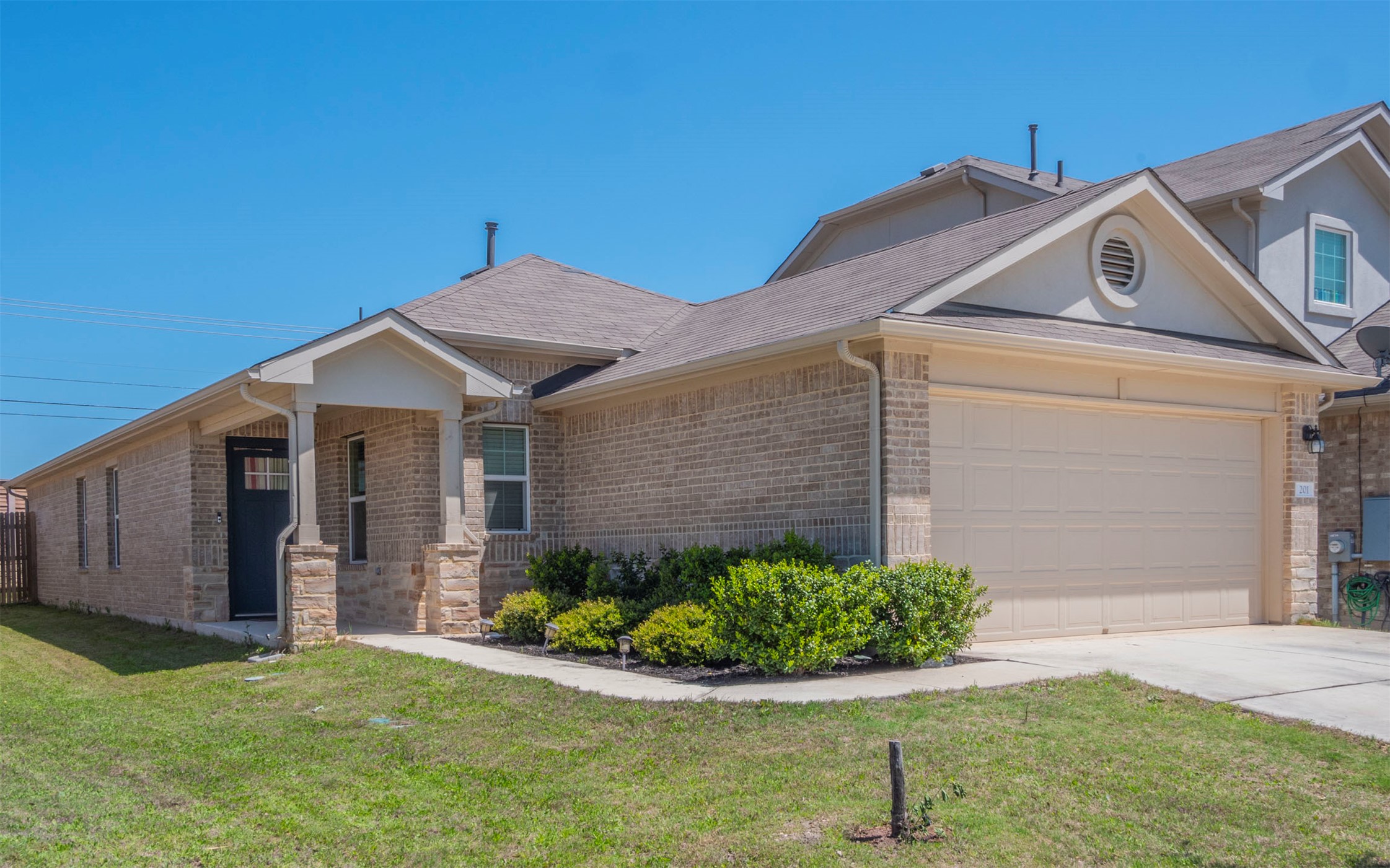 201 Frederick Drive Georgetown, TX 78626 - Photo 1 of 1 a front view of a house with garden