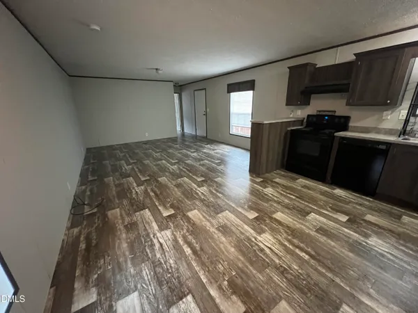 a bedroom with a bed and a television