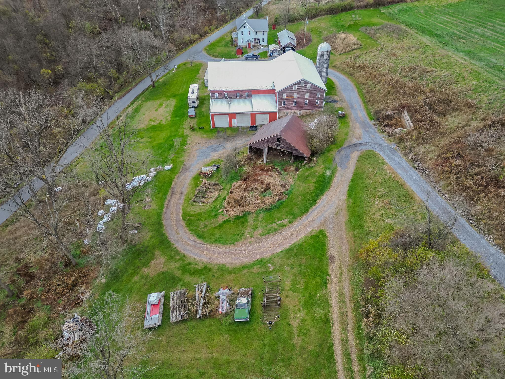 a bird view of a house with a yard and plants