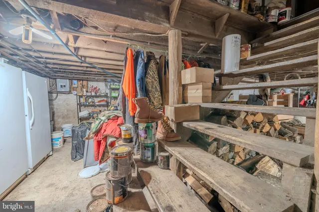 a bed sitting in a bedroom next to a lamp