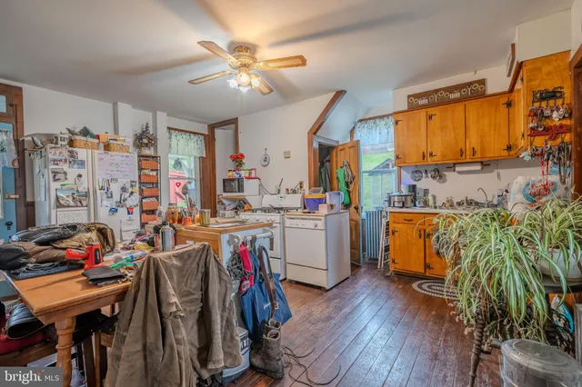 a view of a kitchen with workspace and a window