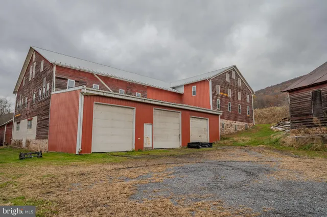 a view of a backyard with table and chairs