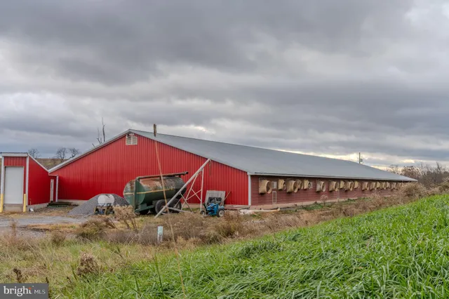 an aerial view of a house with big yard