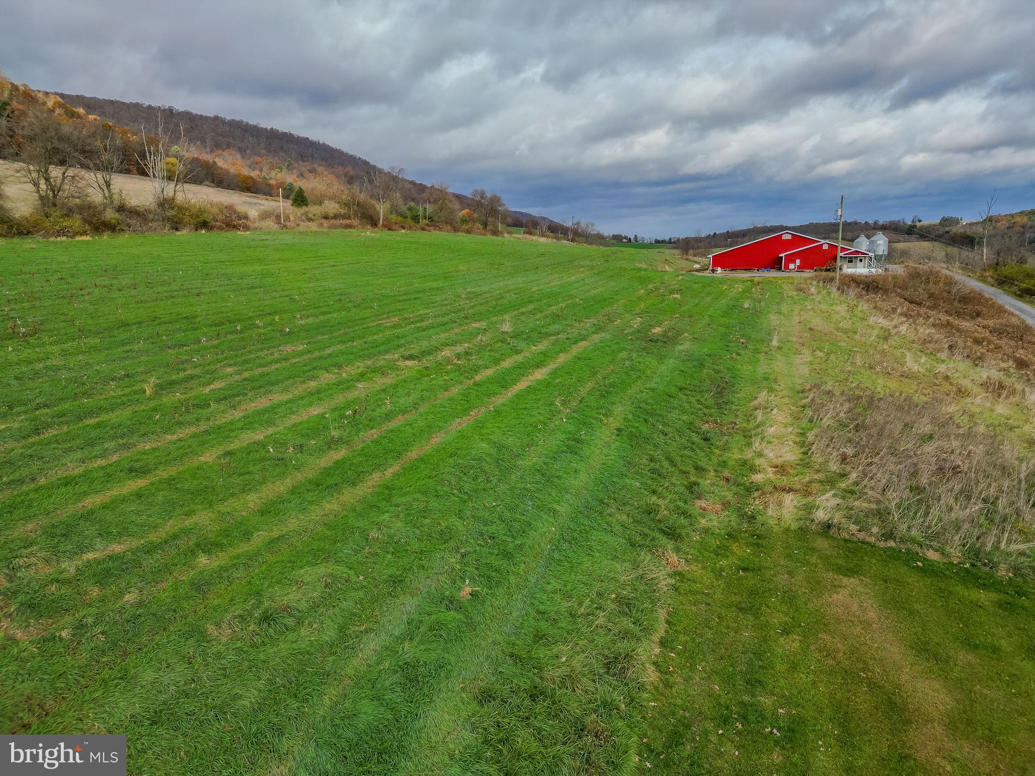 1840 Masden Hollow Road Beech Creek, PA 16822 - Photo 49 of 66 a view of a green field with wooden fence
