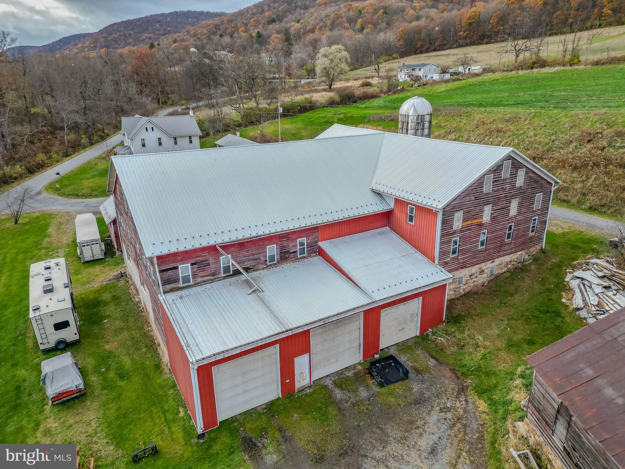 1840 Masden Hollow Road Beech Creek, PA 16822 - Photo 56 of 66 an aerial view of a house with pool and a yard
