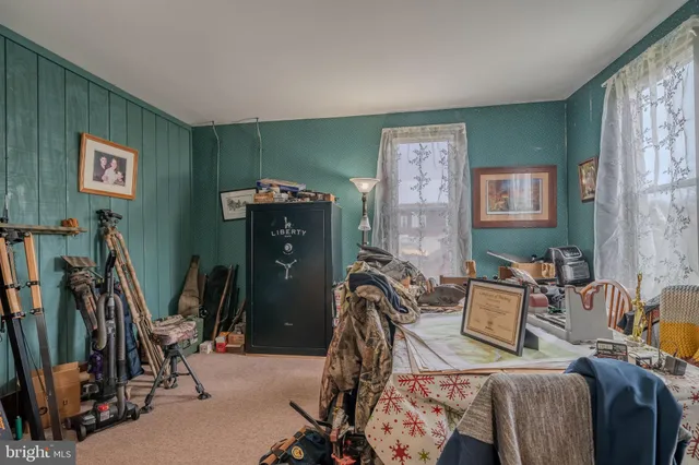 a view of a livingroom with furniture and gym equipment