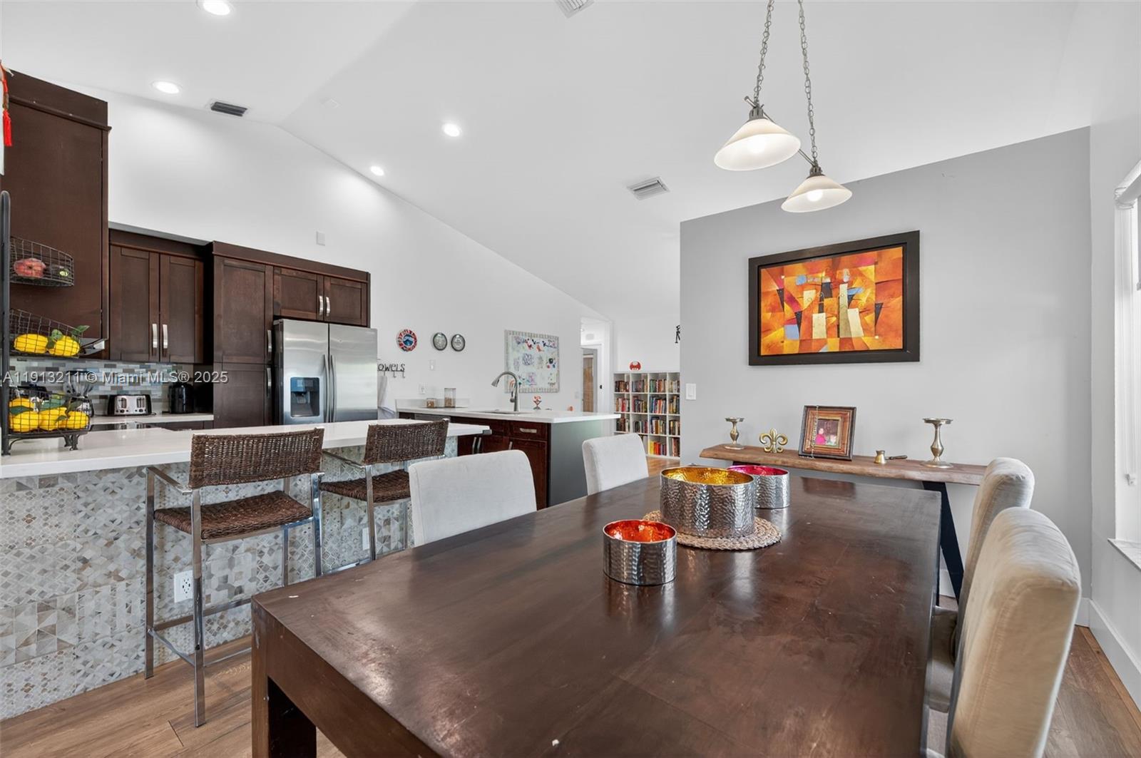 4357 Magnolia Ridge Drive Weston, FL 33331 - Photo 11 of 54 a living room with furniture kitchen view and a chandelier