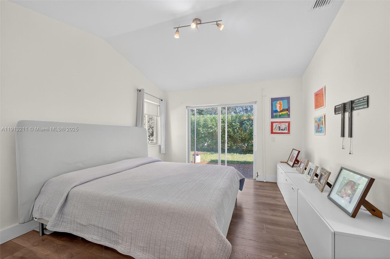 4357 Magnolia Ridge Drive Weston, FL 33331 - Photo 18 of 54 a bed room with a bed and large window