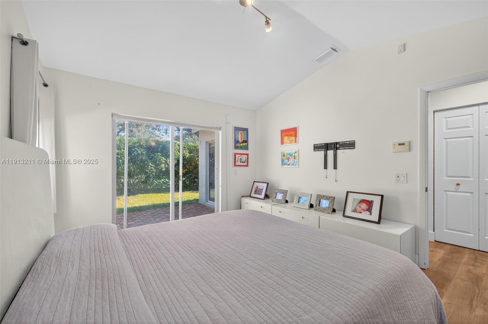 4357 Magnolia Ridge Drive Weston, FL 33331 - Photo 19 of 54 a bedroom with a bed and a large window