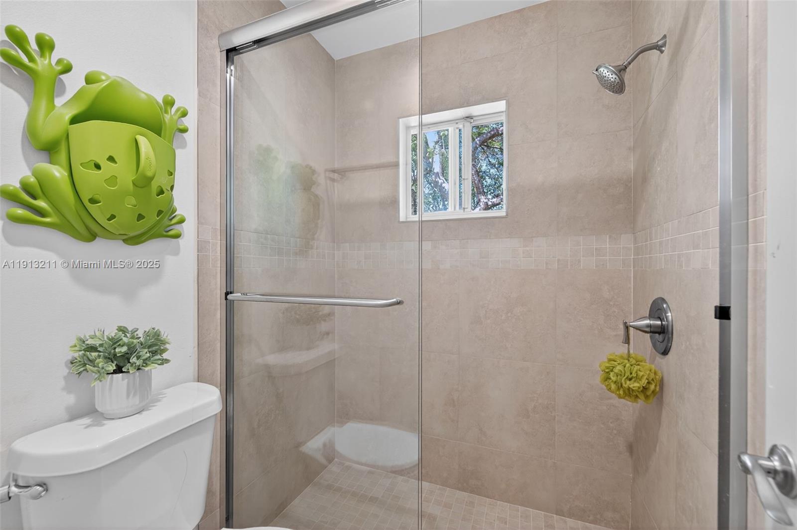 4357 Magnolia Ridge Drive Weston, FL 33331 - Photo 21 of 54 a bathroom with a toilet and a shower