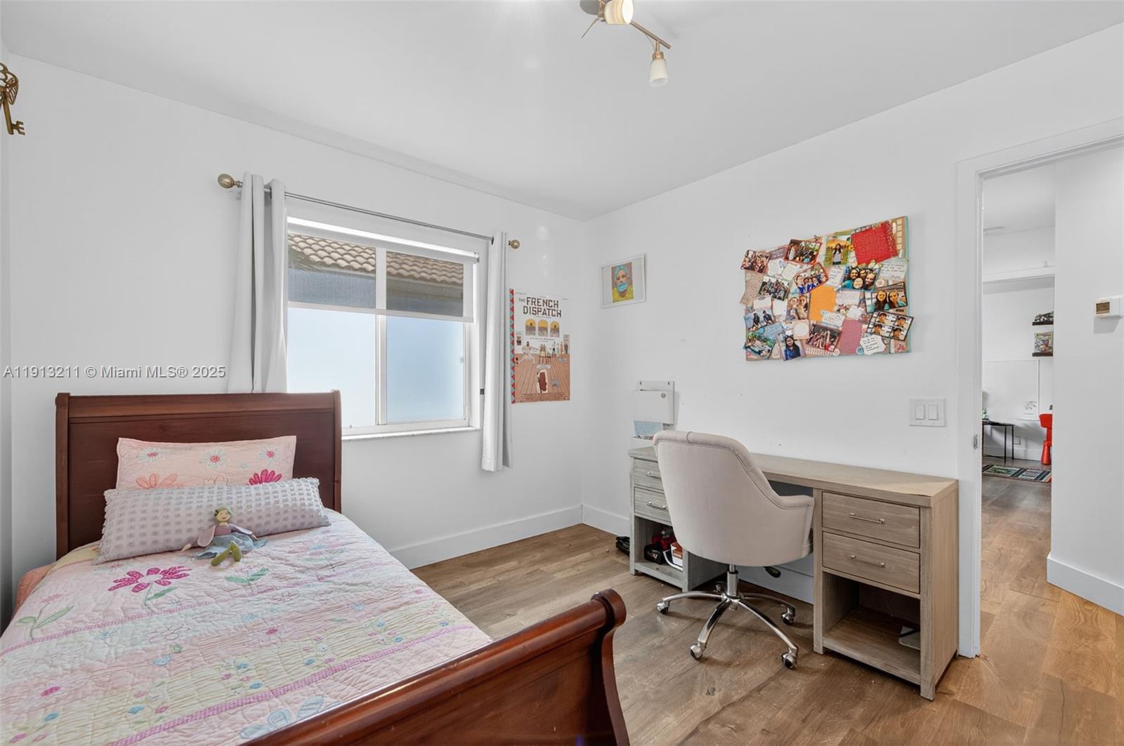 4357 Magnolia Ridge Drive Weston, FL 33331 - Photo 23 of 54 a bedroom with a bed and a chair