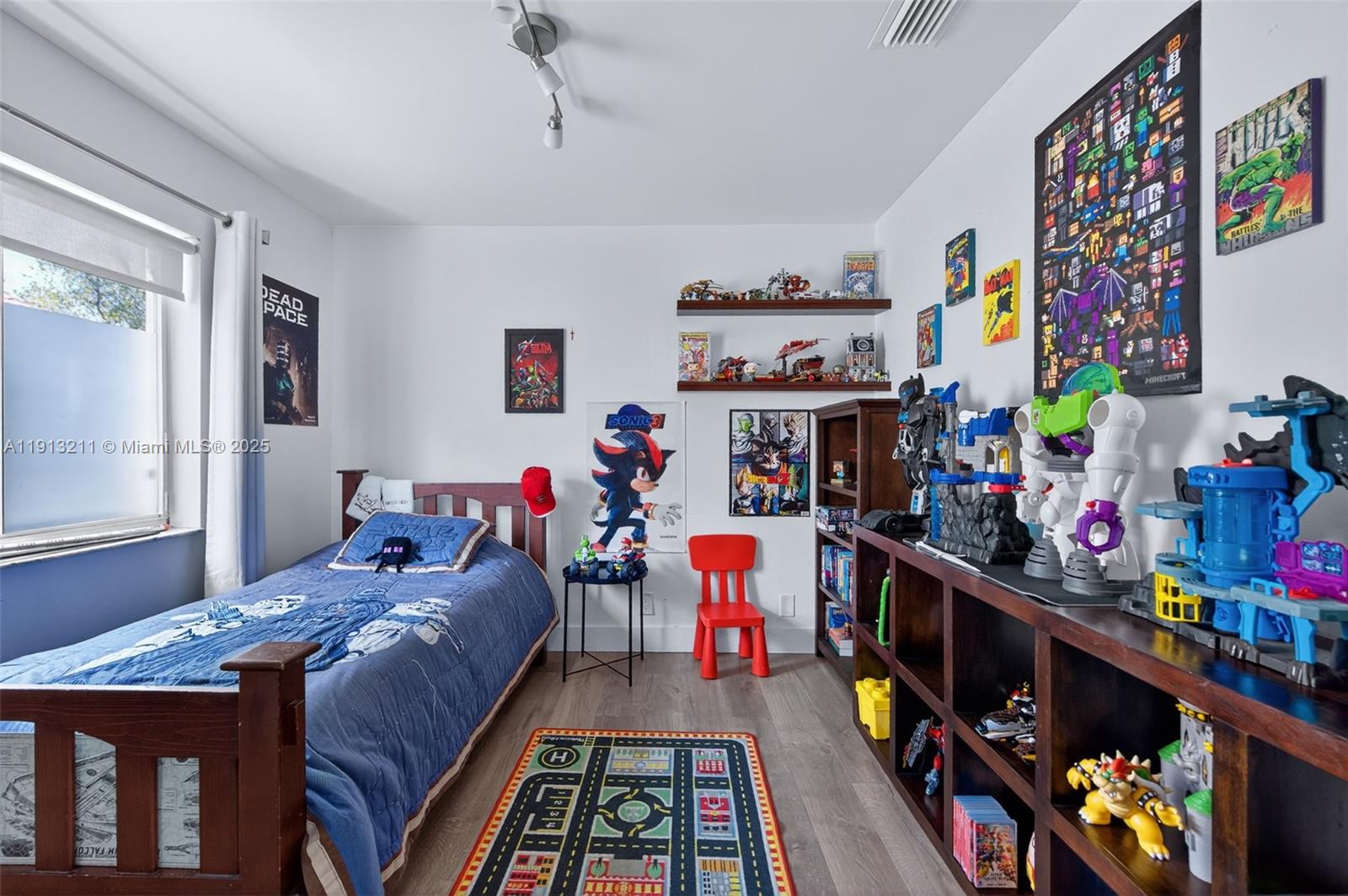 4357 Magnolia Ridge Drive Weston, FL 33331 - Photo 25 of 54 a bed room with a bed a baby crib and a window