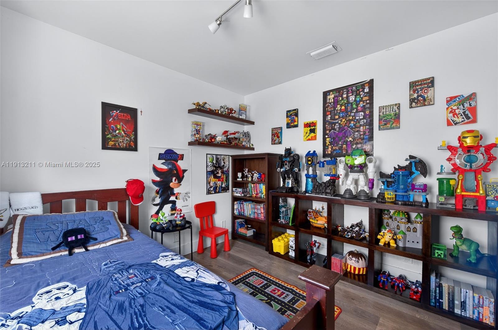 4357 Magnolia Ridge Drive Weston, FL 33331 - Photo 26 of 54 a room with furniture and a book shelf