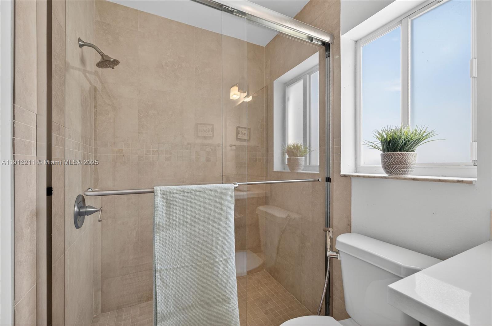 4357 Magnolia Ridge Drive Weston, FL 33331 - Photo 28 of 54 a bathroom with a shower and toilet