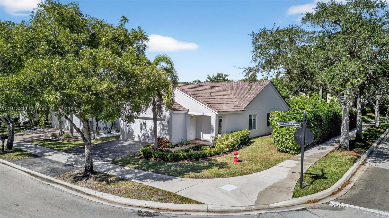 4357 Magnolia Ridge Drive Weston, FL 33331 - Photo 31 of 54 a view of a house with yard and plants