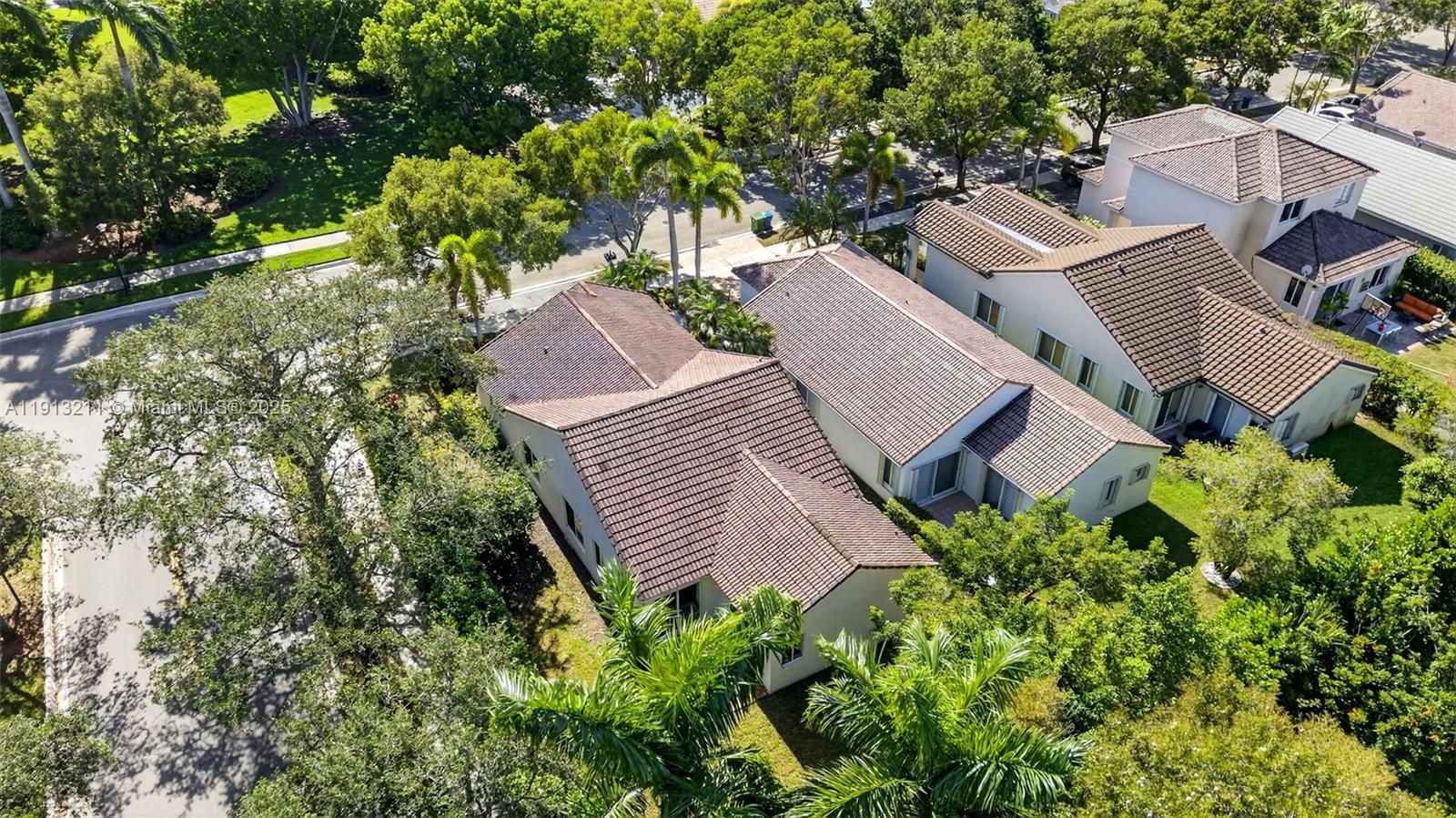 4357 Magnolia Ridge Drive Weston, FL 33331 - Photo 36 of 54 an aerial view of a house with garden space and trees all around