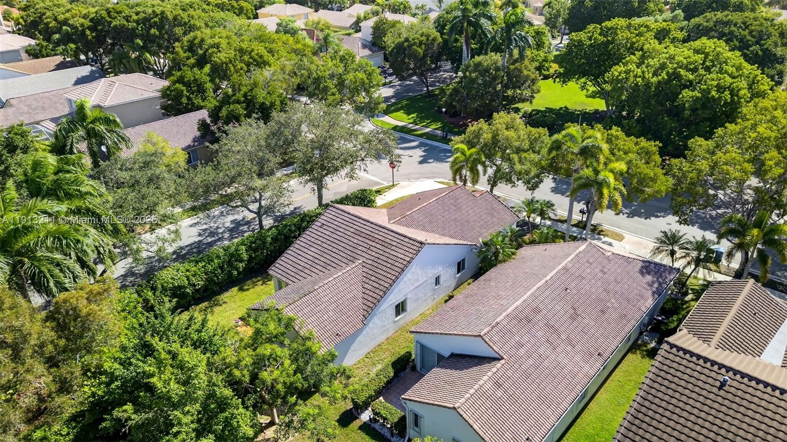4357 Magnolia Ridge Drive Weston, FL 33331 - Photo 37 of 54 an aerial view of a house with a yard