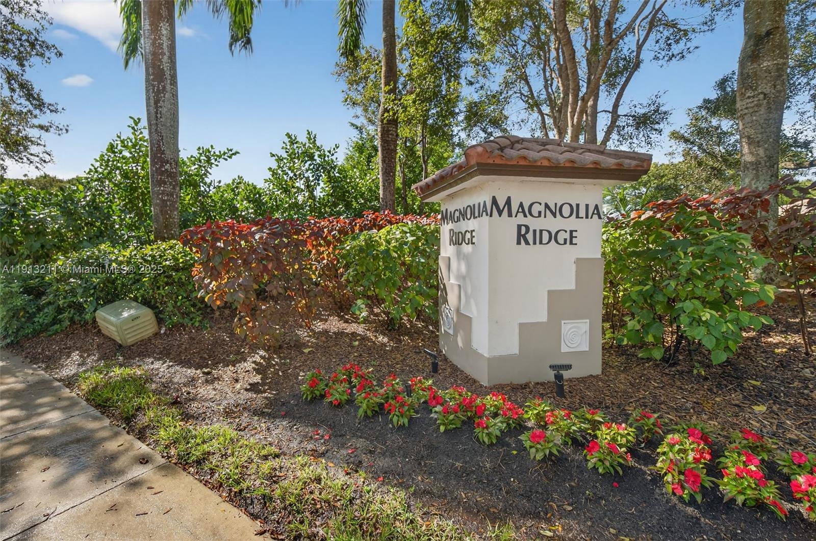 4357 Magnolia Ridge Drive Weston, FL 33331 - Photo 40 of 54 a front view of a house with a yard and fountain