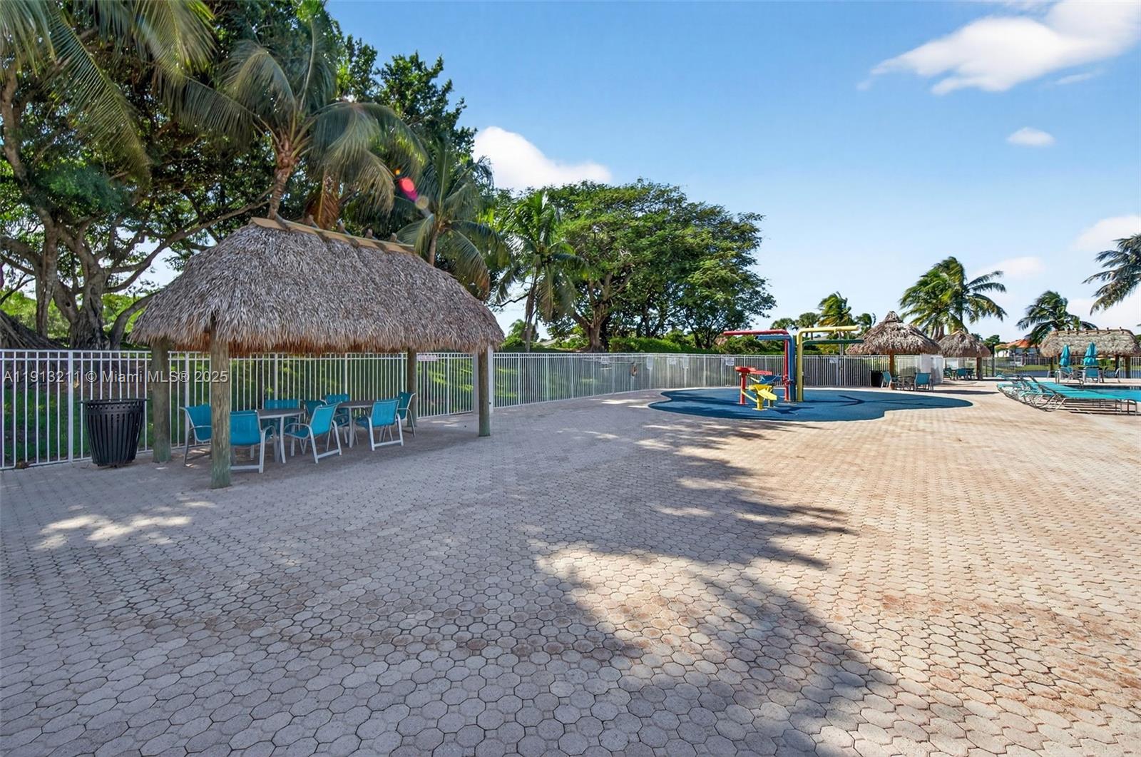 4357 Magnolia Ridge Drive Weston, FL 33331 - Photo 43 of 54 a view of a house with a yard and sitting area