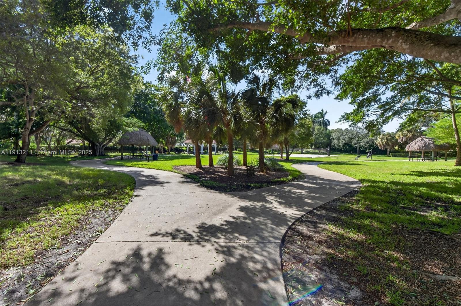 4357 Magnolia Ridge Drive Weston, FL 33331 - Photo 45 of 54 a view of a park with large trees