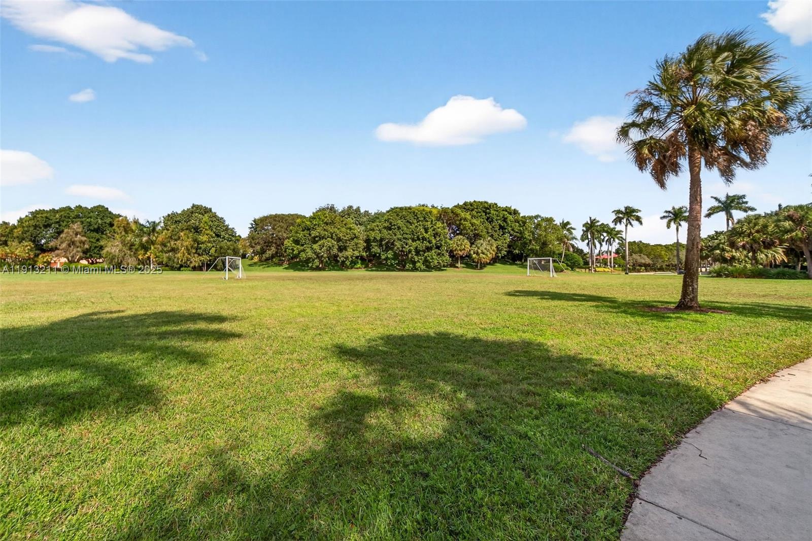 4357 Magnolia Ridge Drive Weston, FL 33331 - Photo 47 of 54 a view of a golf course with a lake