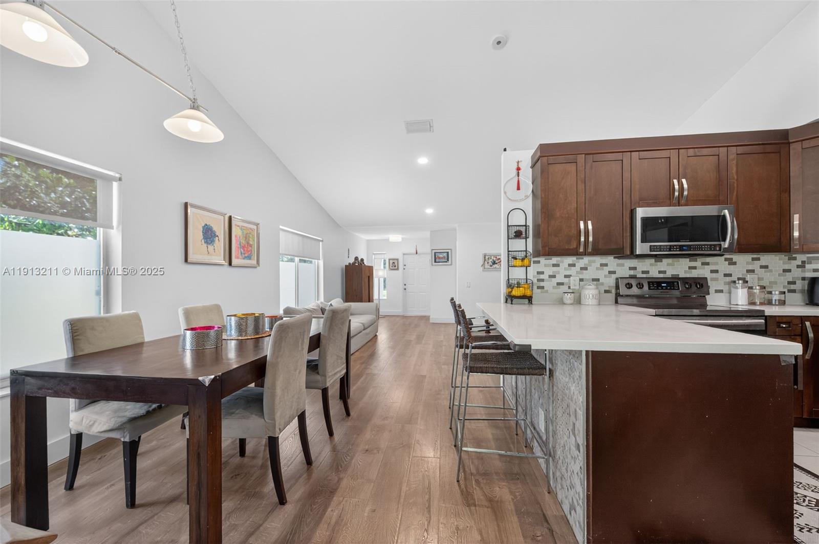 4357 Magnolia Ridge Drive Weston, FL 33331 - Photo 10 of 54 a large kitchen with a table and chairs