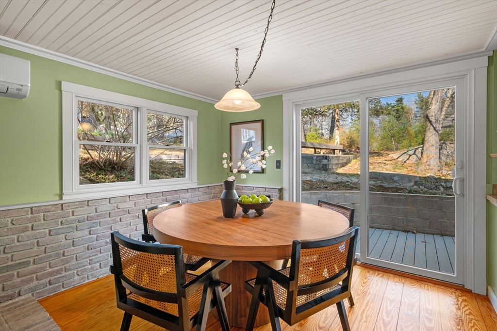 154 R Eastern Avenue Essex, MA 01929 - Photo 11 of 40 a dining room with furniture window and wooden floor