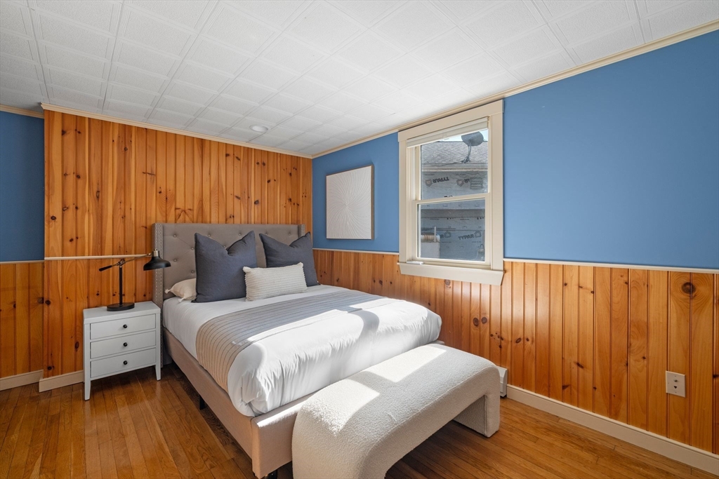 154 R Eastern Avenue Essex, MA 01929 - Photo 14 of 40 a bedroom with a bed and a window