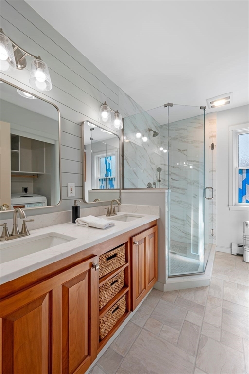 154 R Eastern Avenue Essex, MA 01929 - Photo 23 of 40 a spacious bathroom with a shower a sink and a mirror