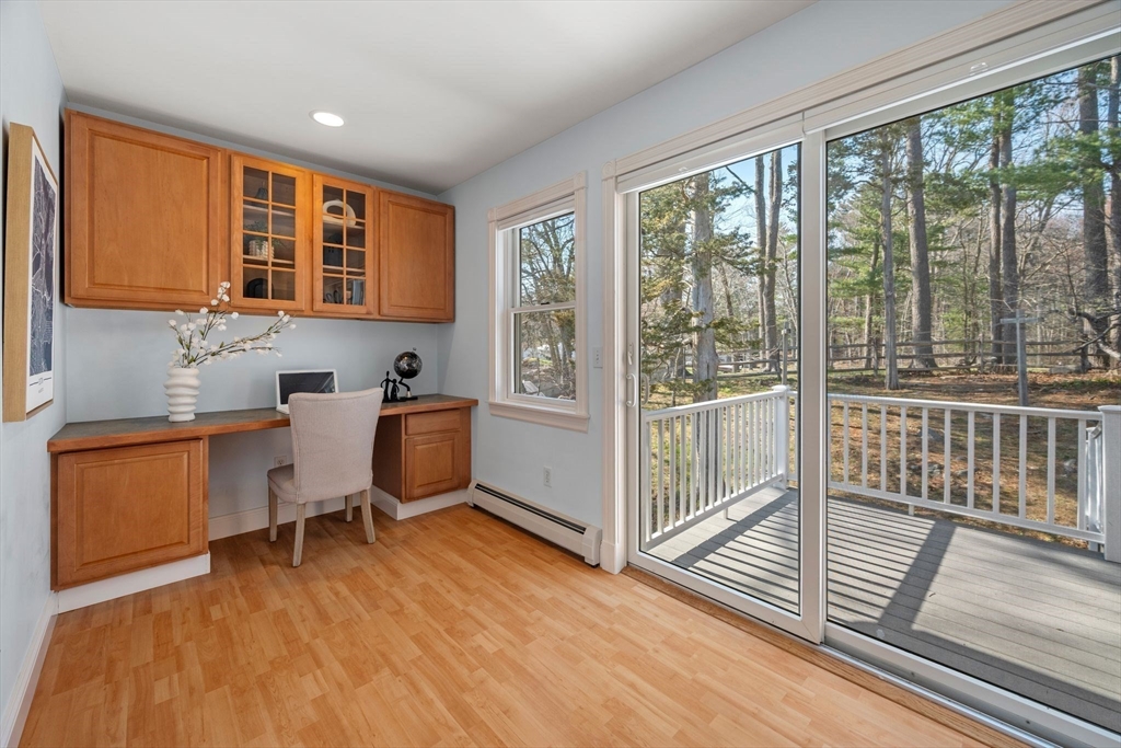 154 R Eastern Avenue Essex, MA 01929 - Photo 27 of 40 a view of a workspace with wooden floor and furniture