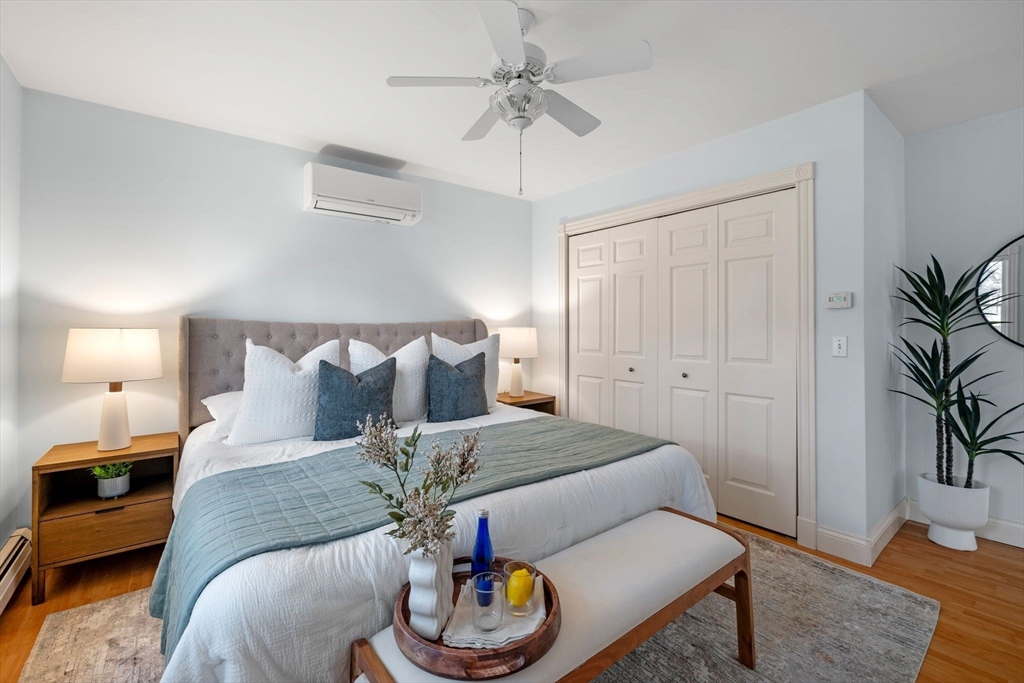 154 R Eastern Avenue Essex, MA 01929 - Photo 28 of 40 a bed room with a bed and a couch