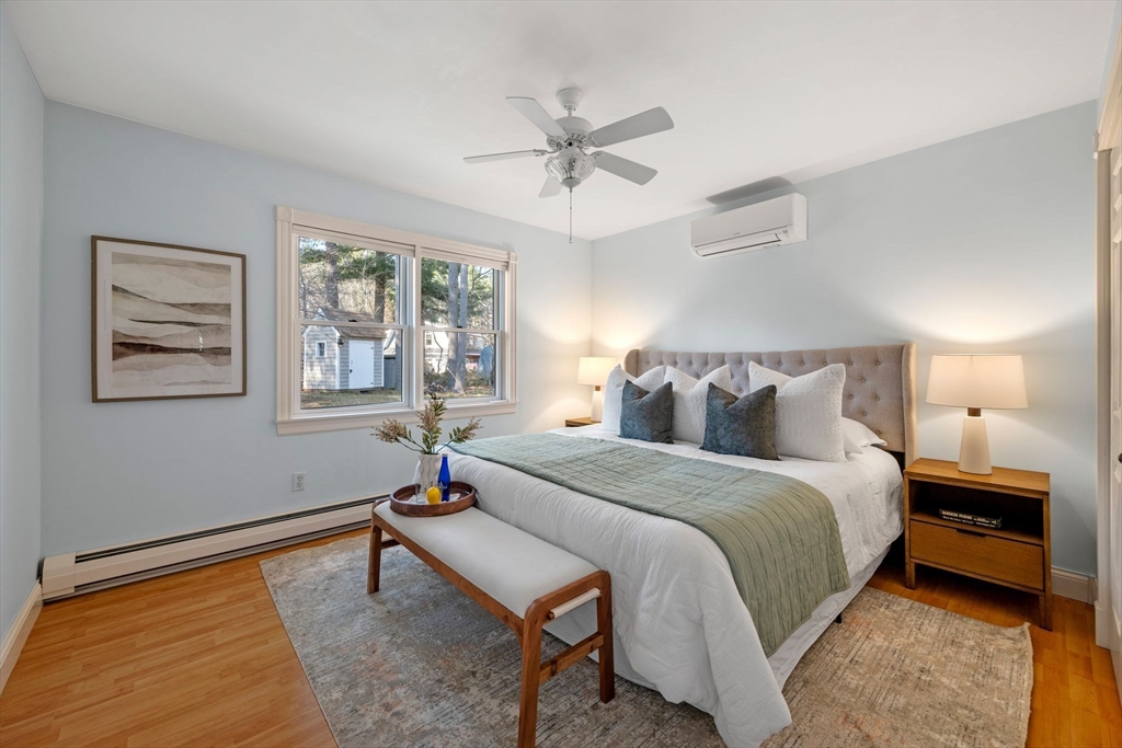 154 R Eastern Avenue Essex, MA 01929 - Photo 29 of 40 a bedroom with bed and a window