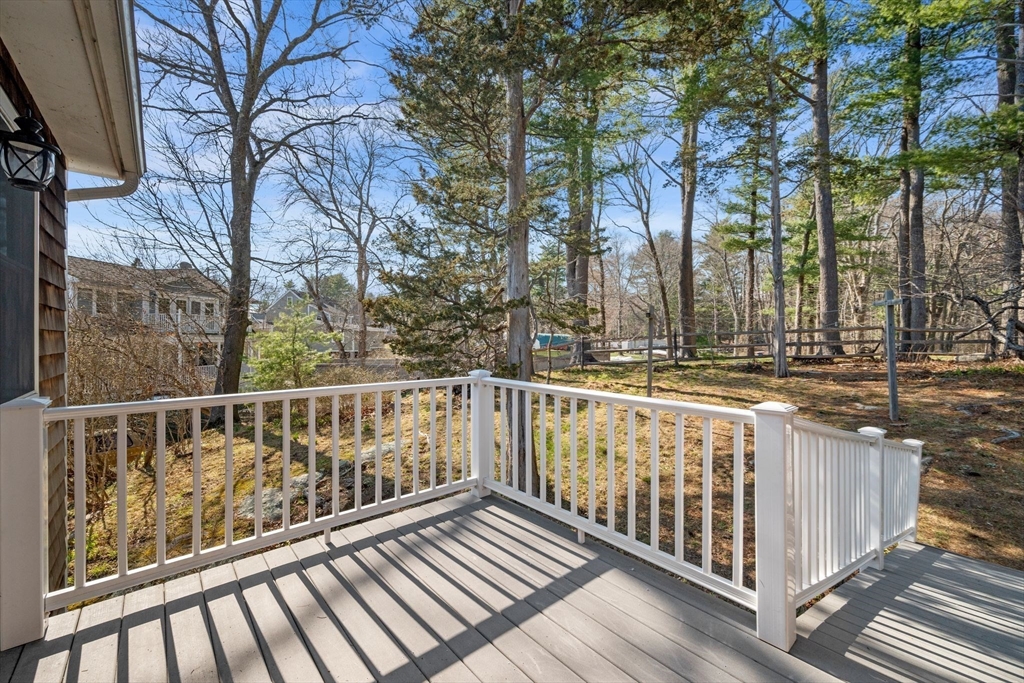 154 R Eastern Avenue Essex, MA 01929 - Photo 30 of 40 a view of a balcony with wooden fence and floor