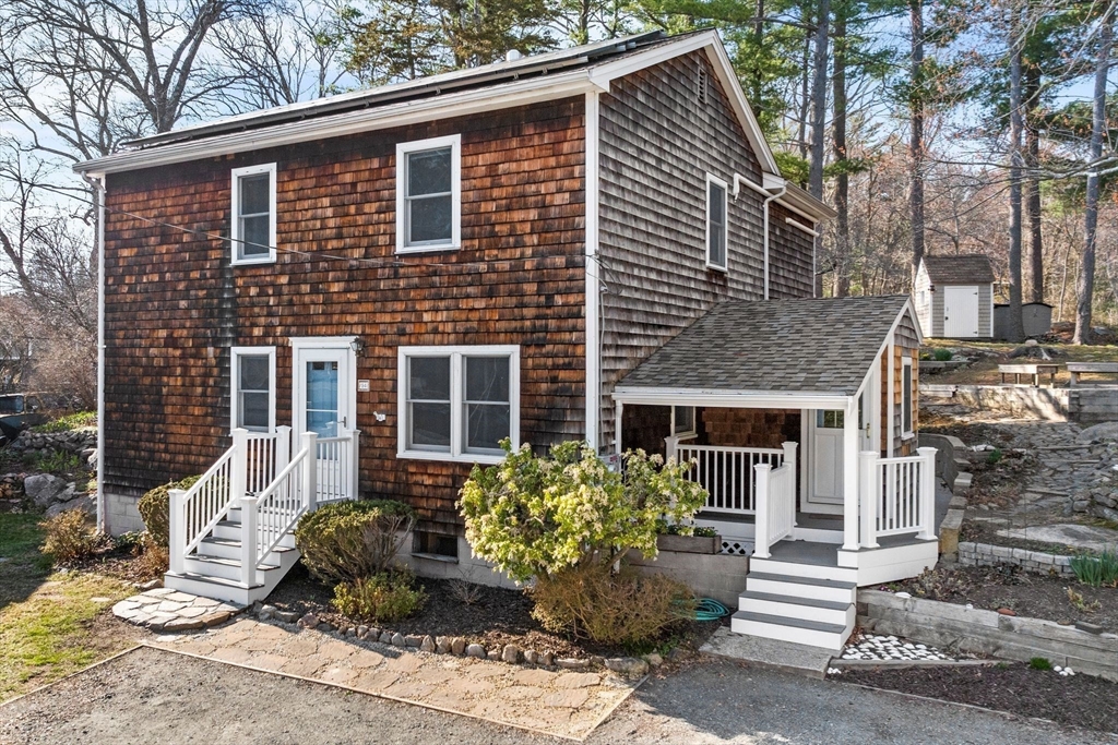 154 R Eastern Avenue Essex, MA 01929 - Photo 34 of 40 a front view of a house with garden