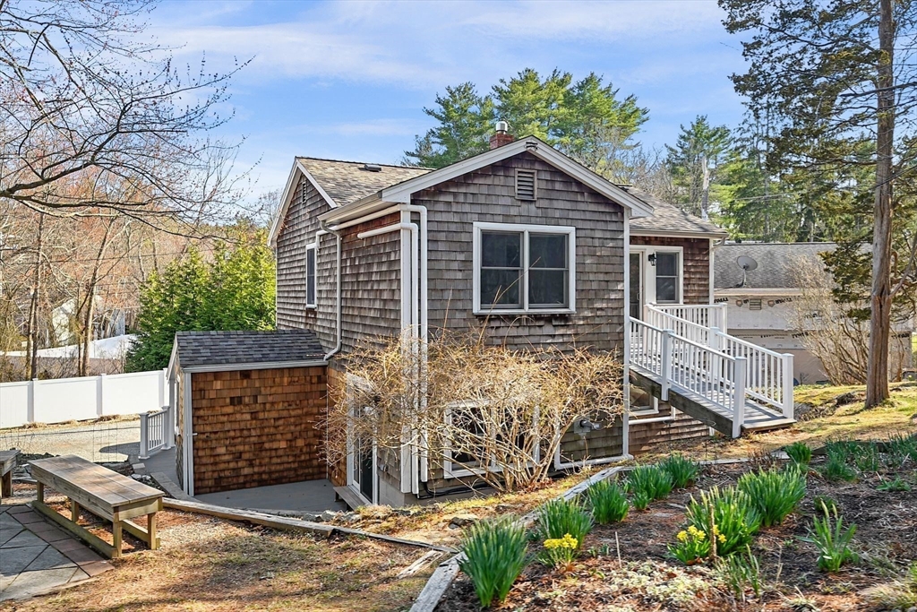 154 R Eastern Avenue Essex, MA 01929 - Photo 35 of 40 a front view of a house with garden