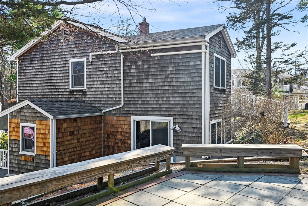 154 R Eastern Avenue Essex, MA 01929 - Photo 36 of 40 a view of a house with a large window and wooden fence