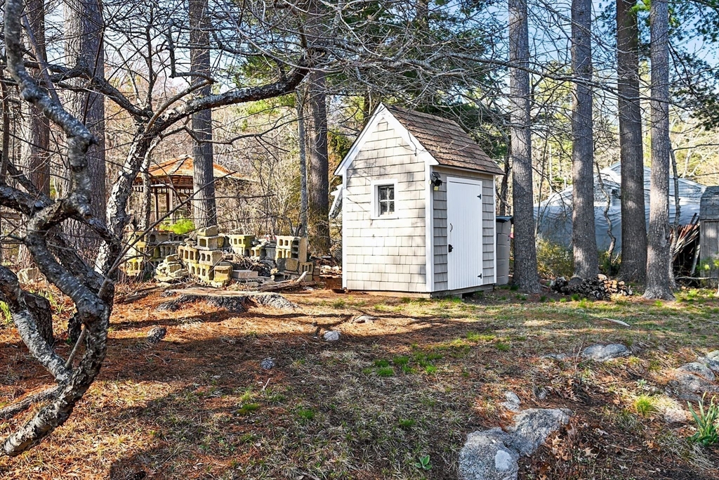 154 R Eastern Avenue Essex, MA 01929 - Photo 37 of 40 a view of a house with a yard and tree s