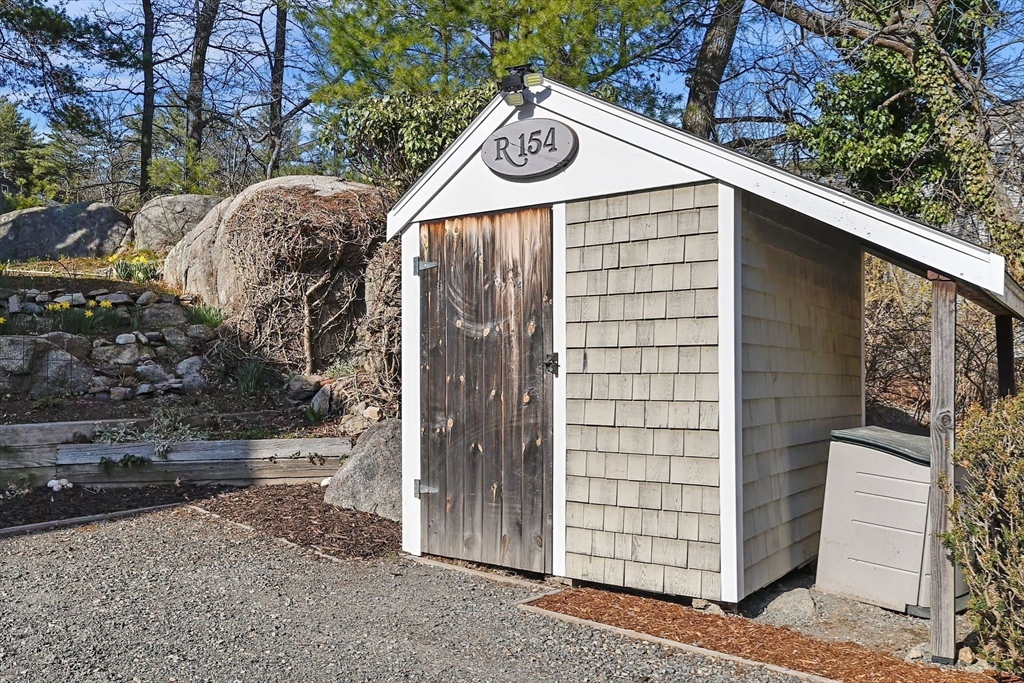 154 R Eastern Avenue Essex, MA 01929 - Photo 38 of 40 a front view of a house with a tree