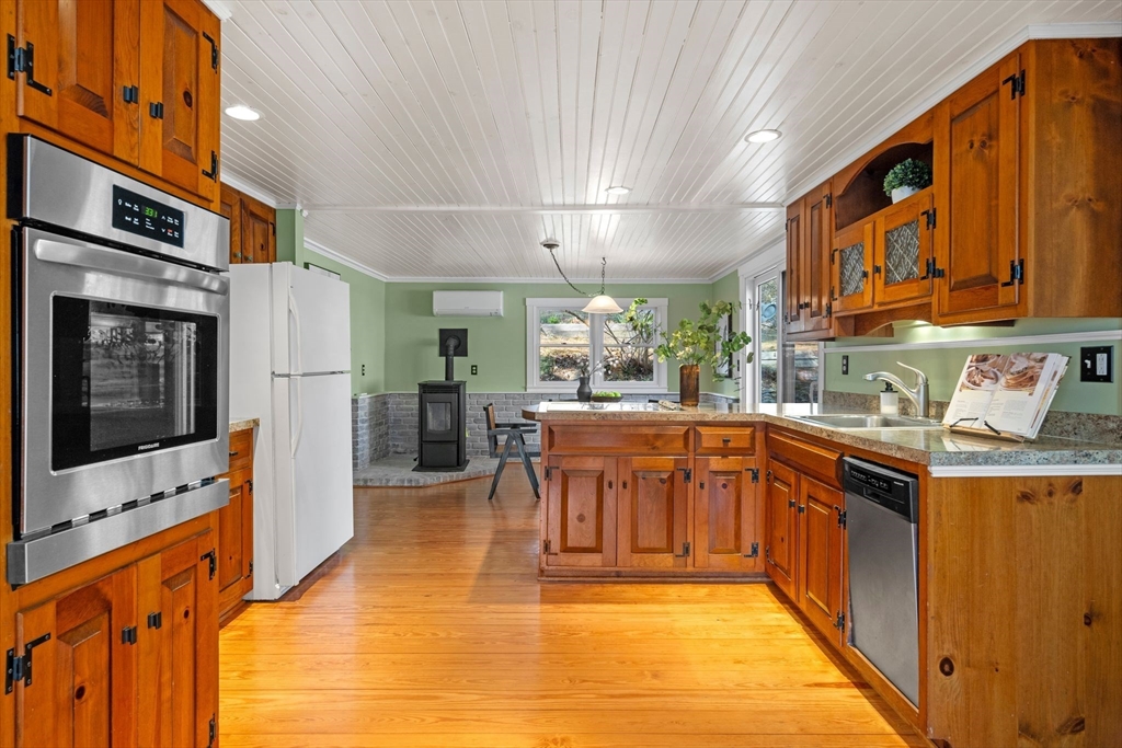 154 R Eastern Avenue Essex, MA 01929 - Photo 7 of 40 a kitchen with stainless steel appliances granite countertop a refrigerator a stove top oven a sink and dishwasher