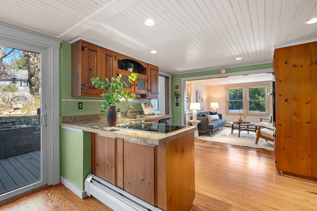154 R Eastern Avenue Essex, MA 01929 - Photo 10 of 40 a kitchen with counter top space and wooden floor