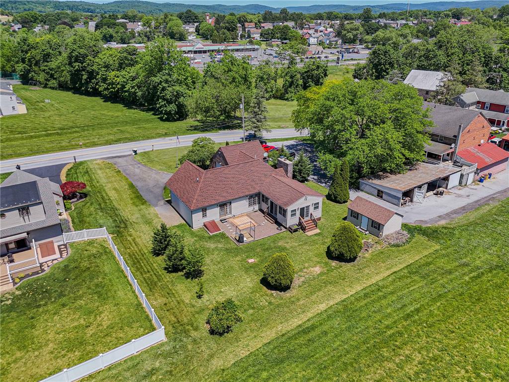 652 Old State Road Oley, PA 19547 - Photo 51 of 54 Discover a charming residence with a well-maintained yard and convenient shed, all set against a backdrop of rolling hills.