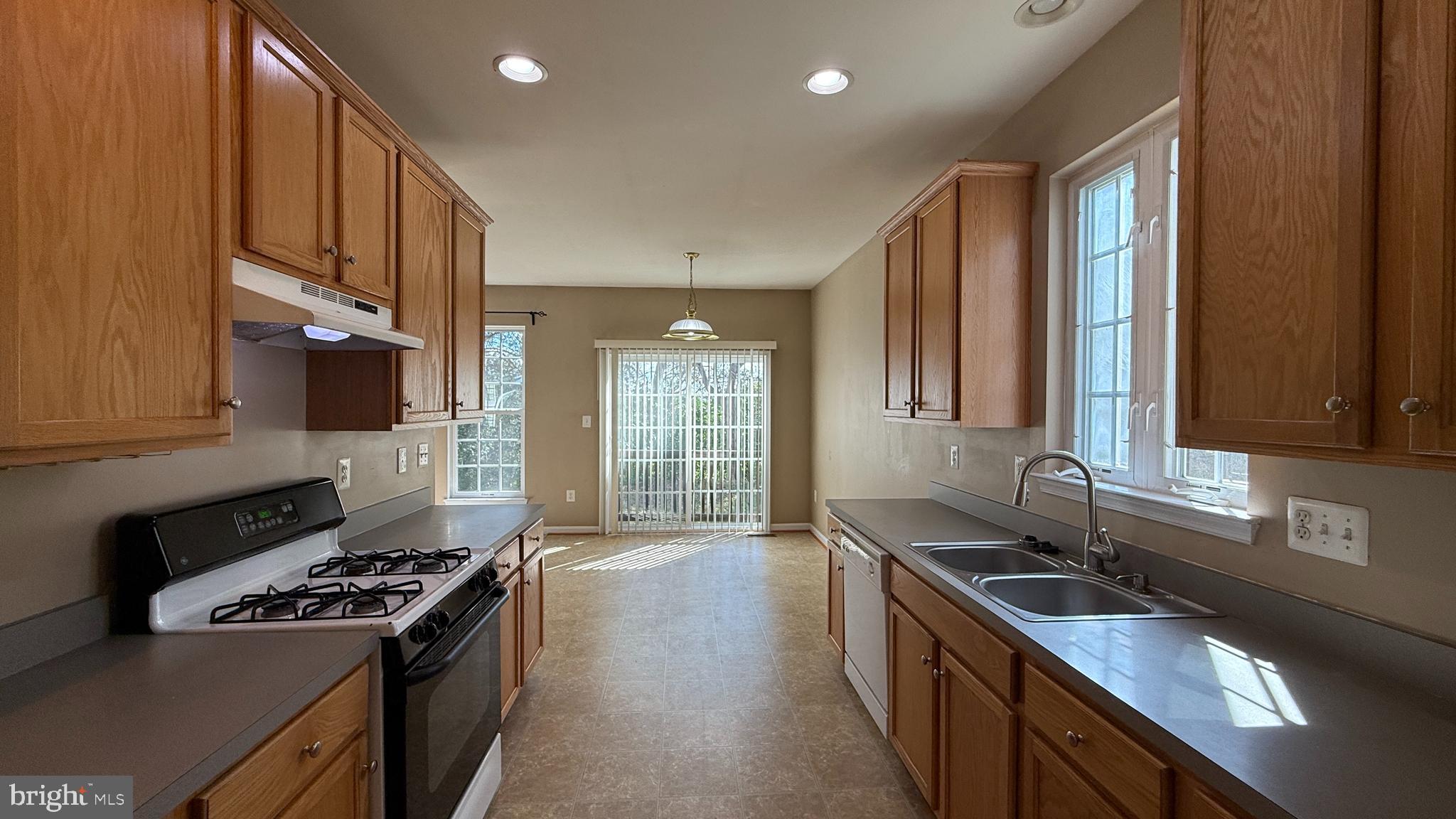 35484 Somerset Ridge Road Locust Grove, VA 22508 - Photo 4 of 22 a kitchen with stainless steel appliances granite countertop a sink stove and cabinets